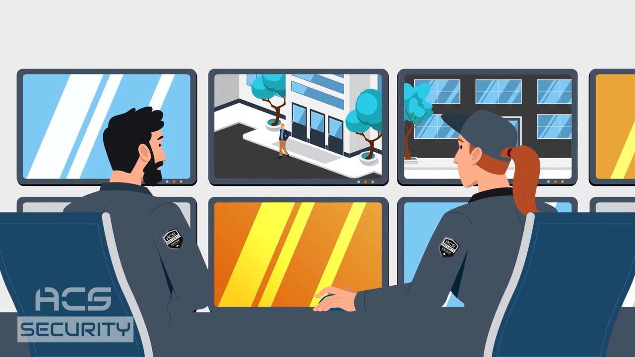 Two agents watching surveillance screens in the ACS Security monitoring room